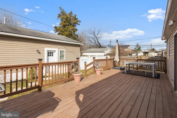 a view of a livingroom with wooden floor and stairs