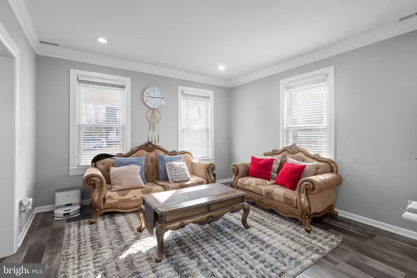 a view of a dining room with furniture wooden floor and a chandelier