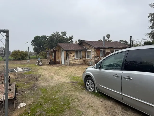 a view of a car parked in front of a house