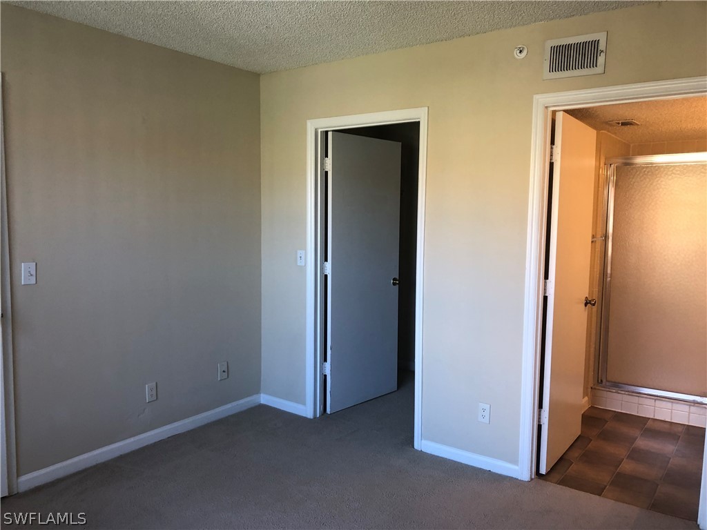 13561 Eagle Ridge Drive, Unit 1025 Fort Myers, FL 33912 - Photo 6 of 11 a view of an empty room