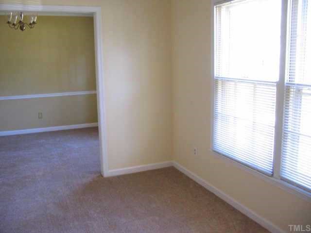 709 Sawmill Road Raleigh, NC 27615 - Photo 3 of 10 an empty room with a window