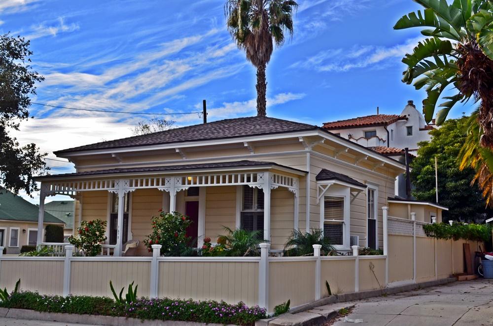 front view of house with potted plants