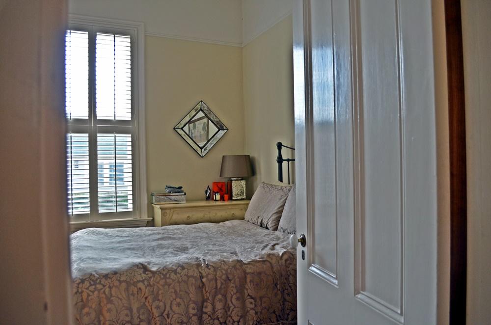 1219 Laguna Street Santa Barbara, CA 93101 - Photo 15 of 25 a bedroom with a bed and a window