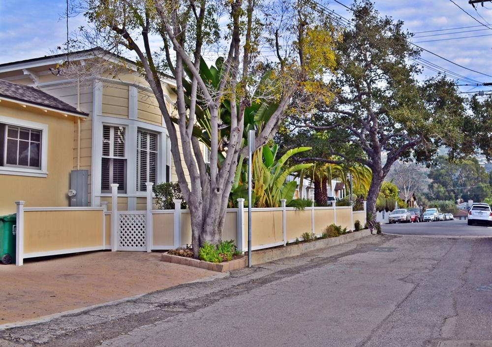 1219 Laguna Street Santa Barbara, CA 93101 - Photo 10 of 25 a view of a house with a tree and wooden fence