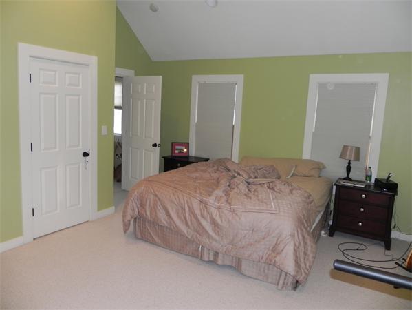 2 Birchmeadow Road Amesbury, MA 01913 - Photo 11 of 22 a bedroom with a bed and a mirror