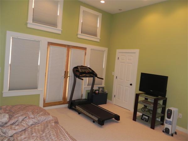 2 Birchmeadow Road Amesbury, MA 01913 - Photo 12 of 22 a room with gym equipment and a flat screen tv
