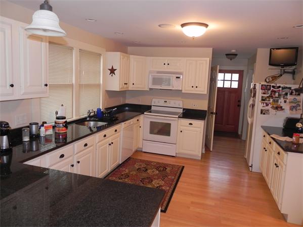 2 Birchmeadow Road Amesbury, MA 01913 - Photo 3 of 22 a kitchen with granite countertop a stove a sink dishwasher and a refrigerator with wooden floor