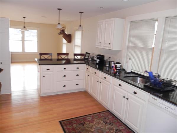 2 Birchmeadow Road Amesbury, MA 01913 - Photo 4 of 22 a kitchen with granite countertop white cabinets and window