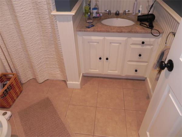 2 Birchmeadow Road Amesbury, MA 01913 - Photo 5 of 22 a bathroom with a sink and a mirror