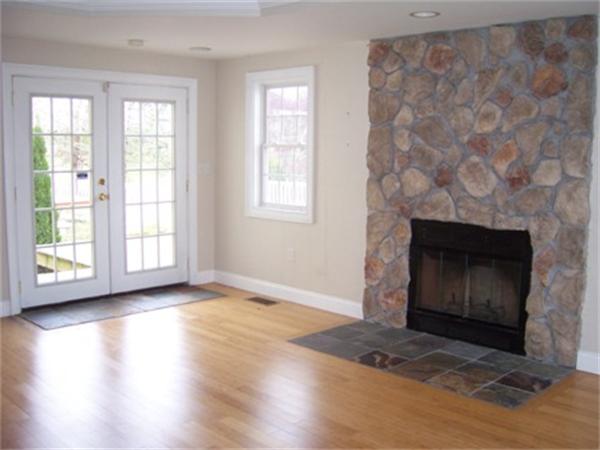 55 Perry Hill Road Acushnet, MA 02743 - Photo 12 of 13 an empty room with wooden floor fireplace and windows