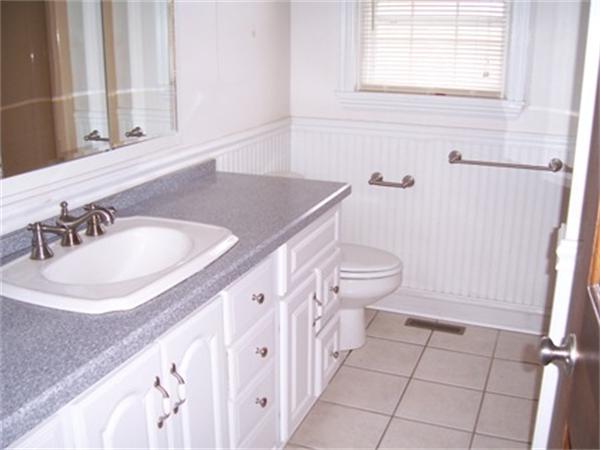 55 Perry Hill Road Acushnet, MA 02743 - Photo 13 of 13 a bathroom with a granite countertop sink and a toilet