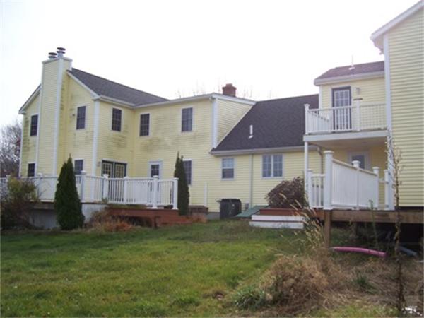 55 Perry Hill Road Acushnet, MA 02743 - Photo 5 of 13 a view of a house with a backyard