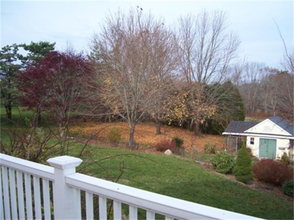 55 Perry Hill Road Acushnet, MA 02743 - Photo 7 of 13 a view of a lake with a house in the background