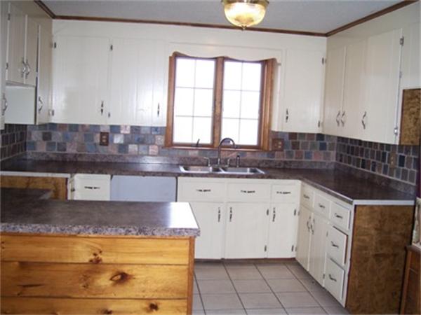 55 Perry Hill Road Acushnet, MA 02743 - Photo 9 of 13 a kitchen with granite countertop white cabinets and white appliances