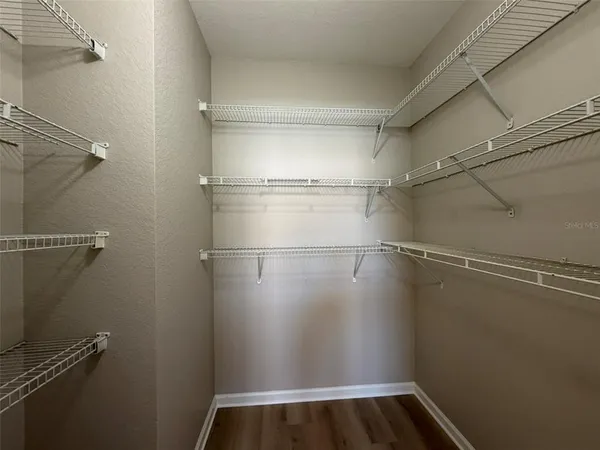 a view of a room with racks on the wall