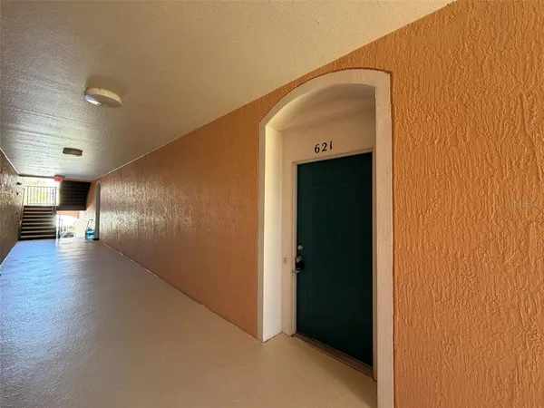 a view of gallery with wooden floor