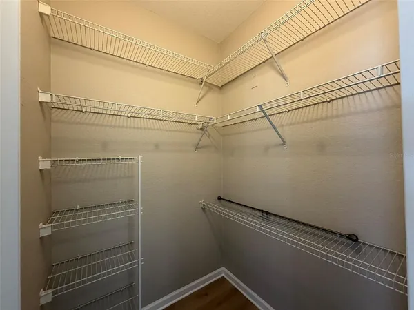 a view of a room with racks on the wall