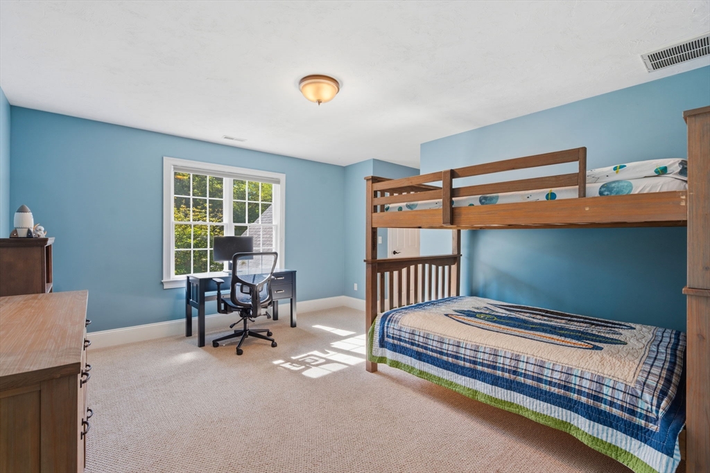 220 Newtown Road Acton, MA 01720 - Photo 20 of 39 a bedroom with furniture and windows