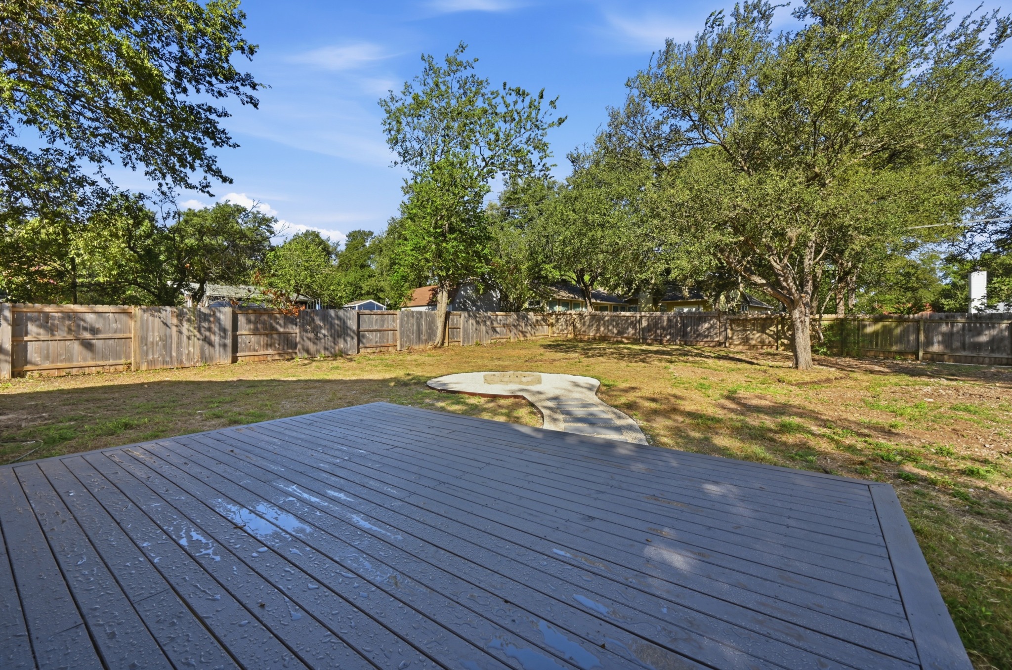 8102 Fort Sumter Road Austin, TX 78745 - Photo 24 of 28 New sliding glass patio door
Newly added backyard deck
Paved fire pit entertainment area