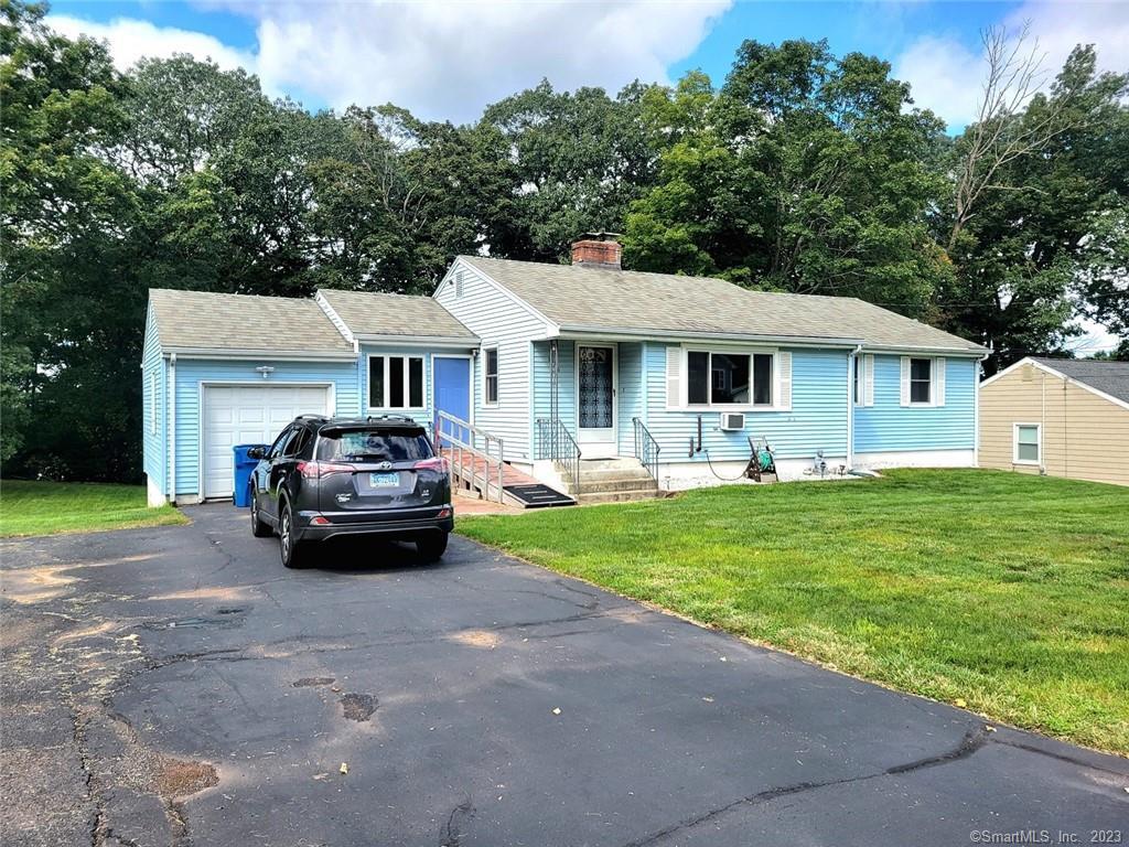 106 Webster Ridge Berlin, CT 06037 - Photo 1 of 1 a car parked in front of a house with a yard