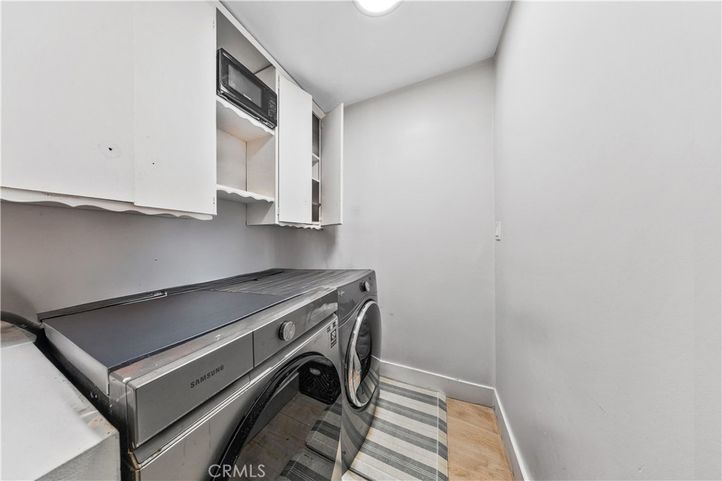 20200 Lassen Street Chatsworth, CA 91311 - Photo 22 of 32 a utility room with dryer and washer