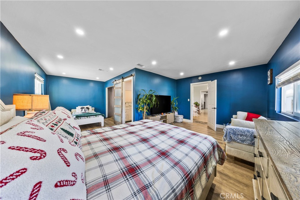 20200 Lassen Street Chatsworth, CA 91311 - Photo 23 of 32 a bedroom with a bed and a dresser