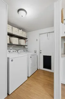 a view of storage and utility room with washer and dryer