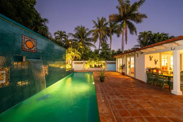 a view of swimming pool with a table and chairs