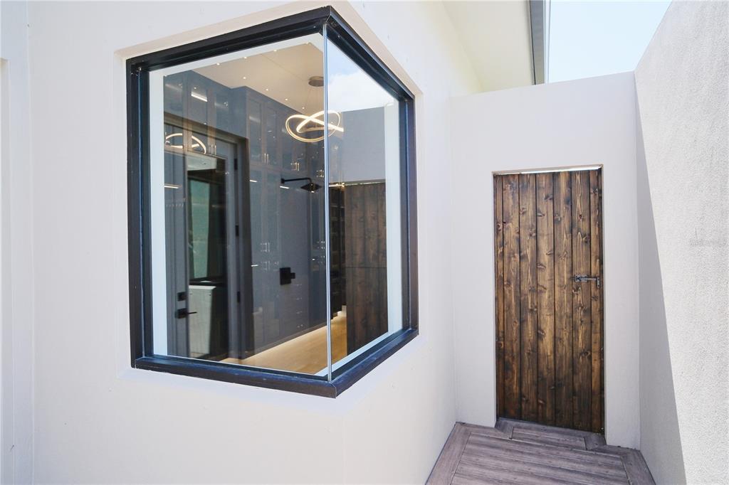 14758 Como Circle Lakewood Ranch, FL 34202 - Photo 34 of 85 a view of a hallway with wooden floor and entryway