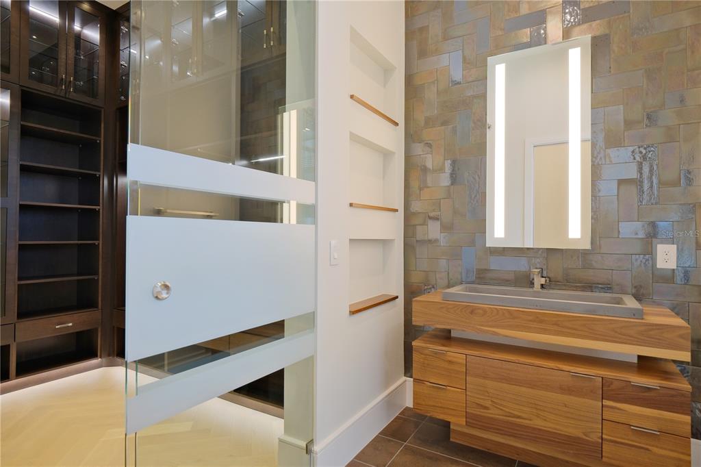 14758 Como Circle Lakewood Ranch, FL 34202 - Photo 46 of 85 a bathroom with a bathtub and a shower