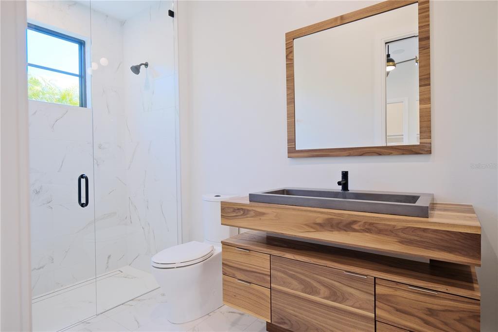 14758 Como Circle Lakewood Ranch, FL 34202 - Photo 51 of 85 a bathroom with a toilet sink and mirror