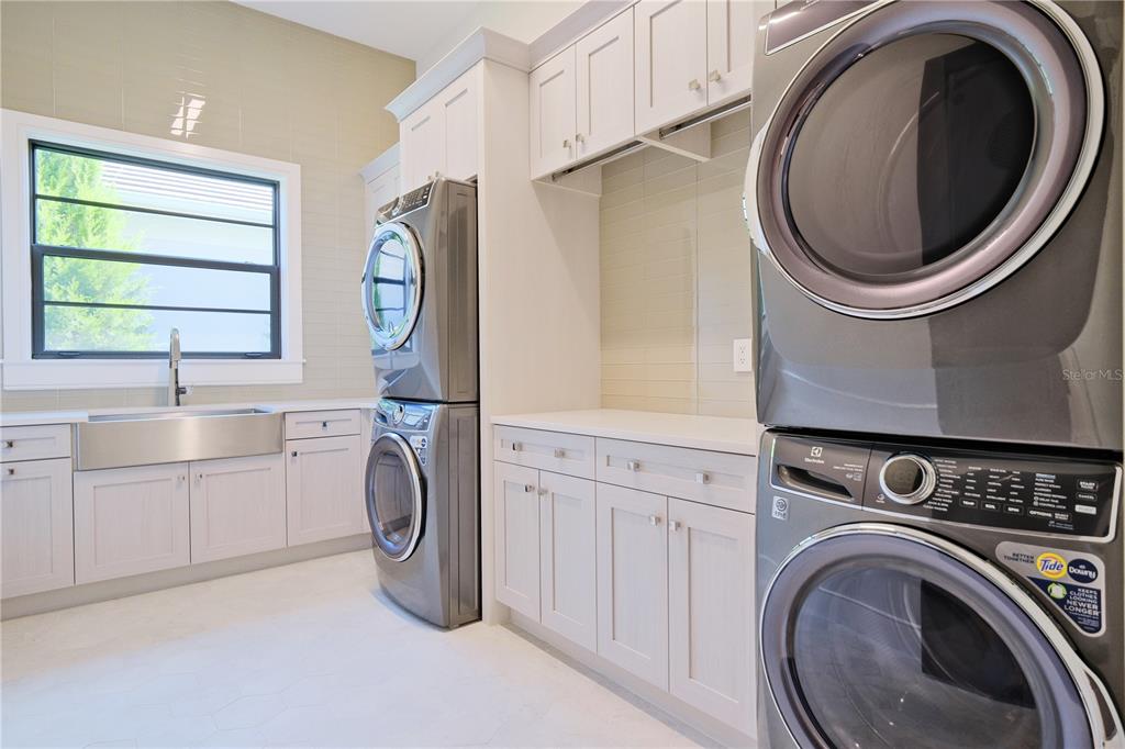 14758 Como Circle Lakewood Ranch, FL 34202 - Photo 53 of 85 a utility room with sink dryer and washer