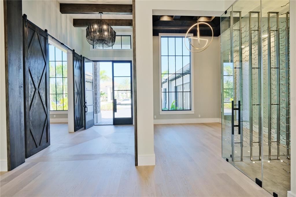 14758 Como Circle Lakewood Ranch, FL 34202 - Photo 6 of 85 a view of entryway and hall with wooden floor