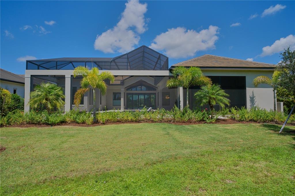 14758 Como Circle Lakewood Ranch, FL 34202 - Photo 69 of 85 a front view of a house with garden