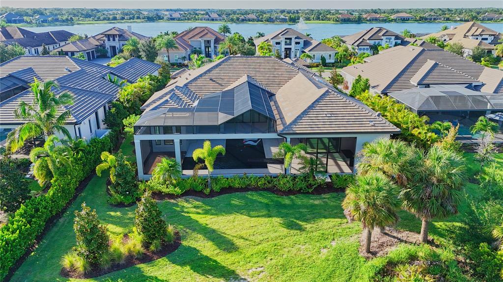 14758 Como Circle Lakewood Ranch, FL 34202 - Photo 72 of 85 an aerial view of house with yard swimming pool and outdoor seating