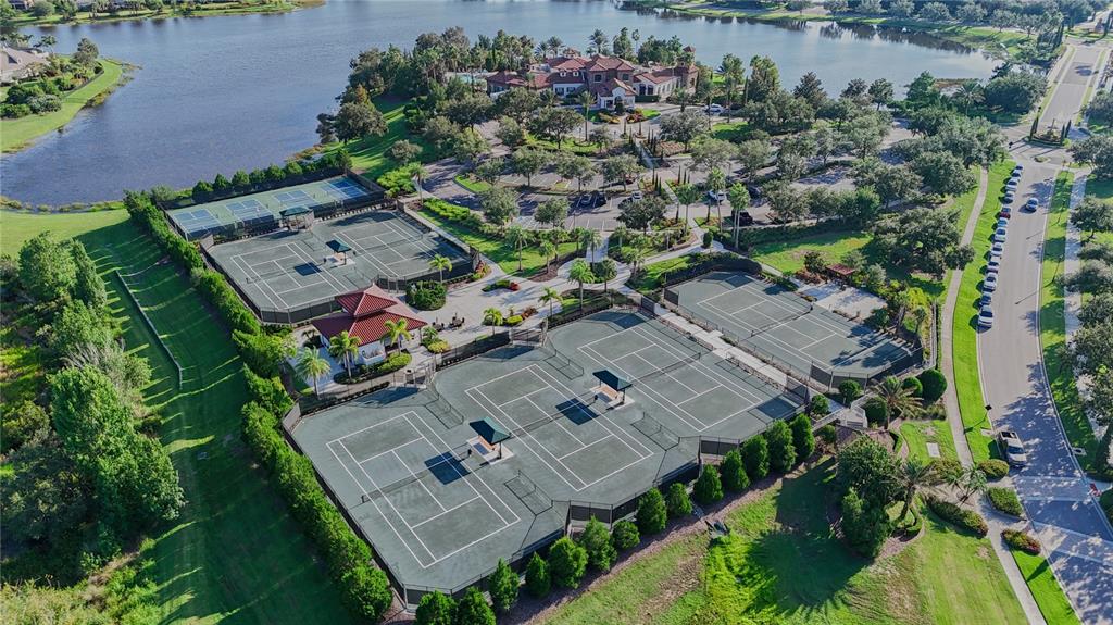 14758 Como Circle Lakewood Ranch, FL 34202 - Photo 81 of 85 an aerial view of a house with a garden and lake view