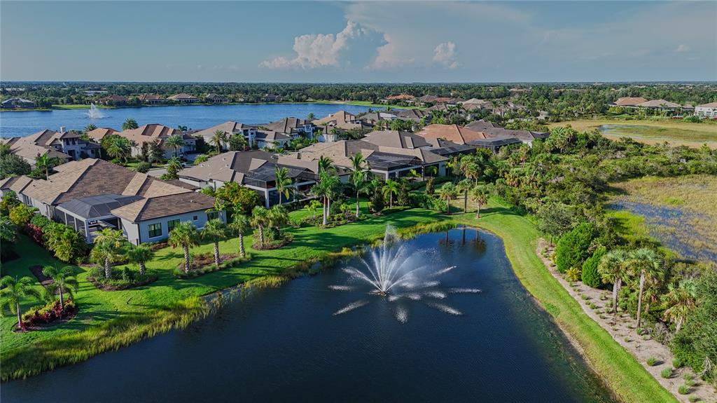 14758 Como Circle Lakewood Ranch, FL 34202 - Photo 85 of 85 an aerial view of a house with a garden and lake view