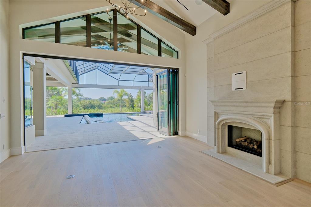 14758 Como Circle Lakewood Ranch, FL 34202 - Photo 10 of 85 a view of livingroom with furniture and a fireplace