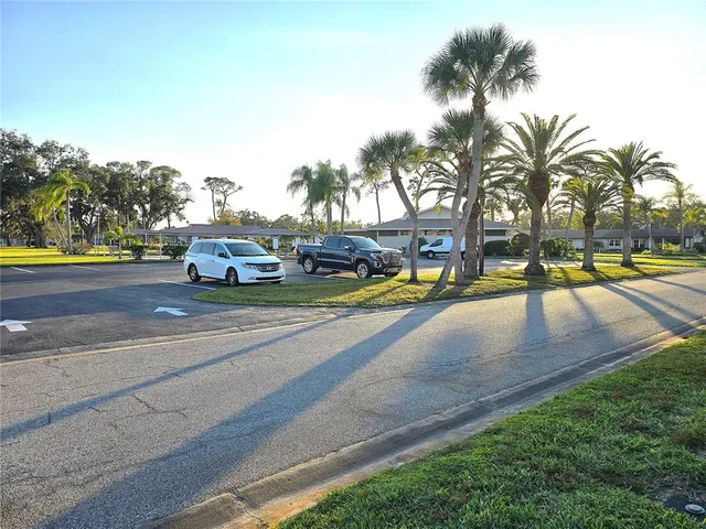 a view of a park with swings and slides