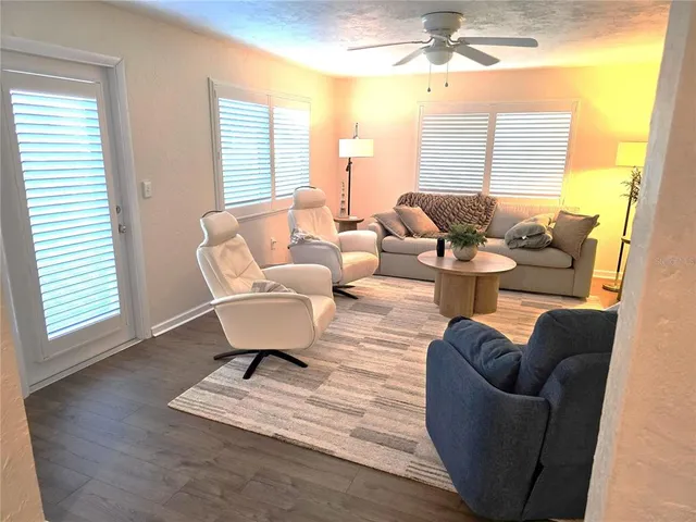 a living room with furniture and a window