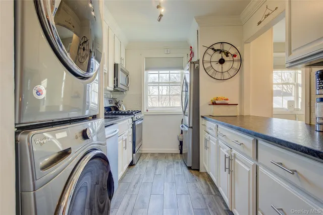 a view of a kitchen with washer and dryer