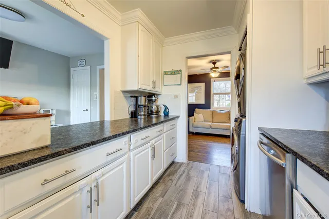 a kitchen with sink and cabinets