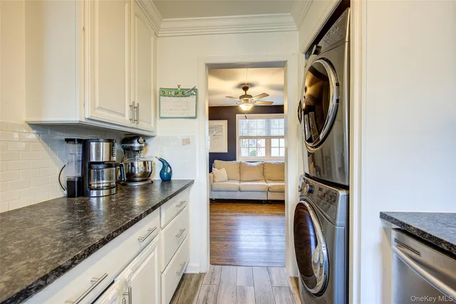 a kitchen with sink a washer and dryer