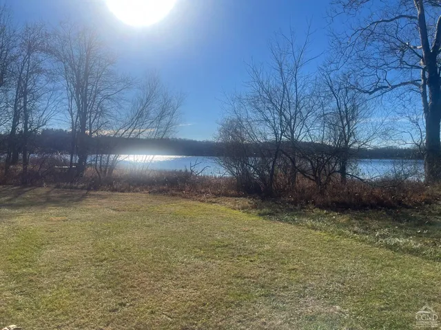 a view of a backyard of the house