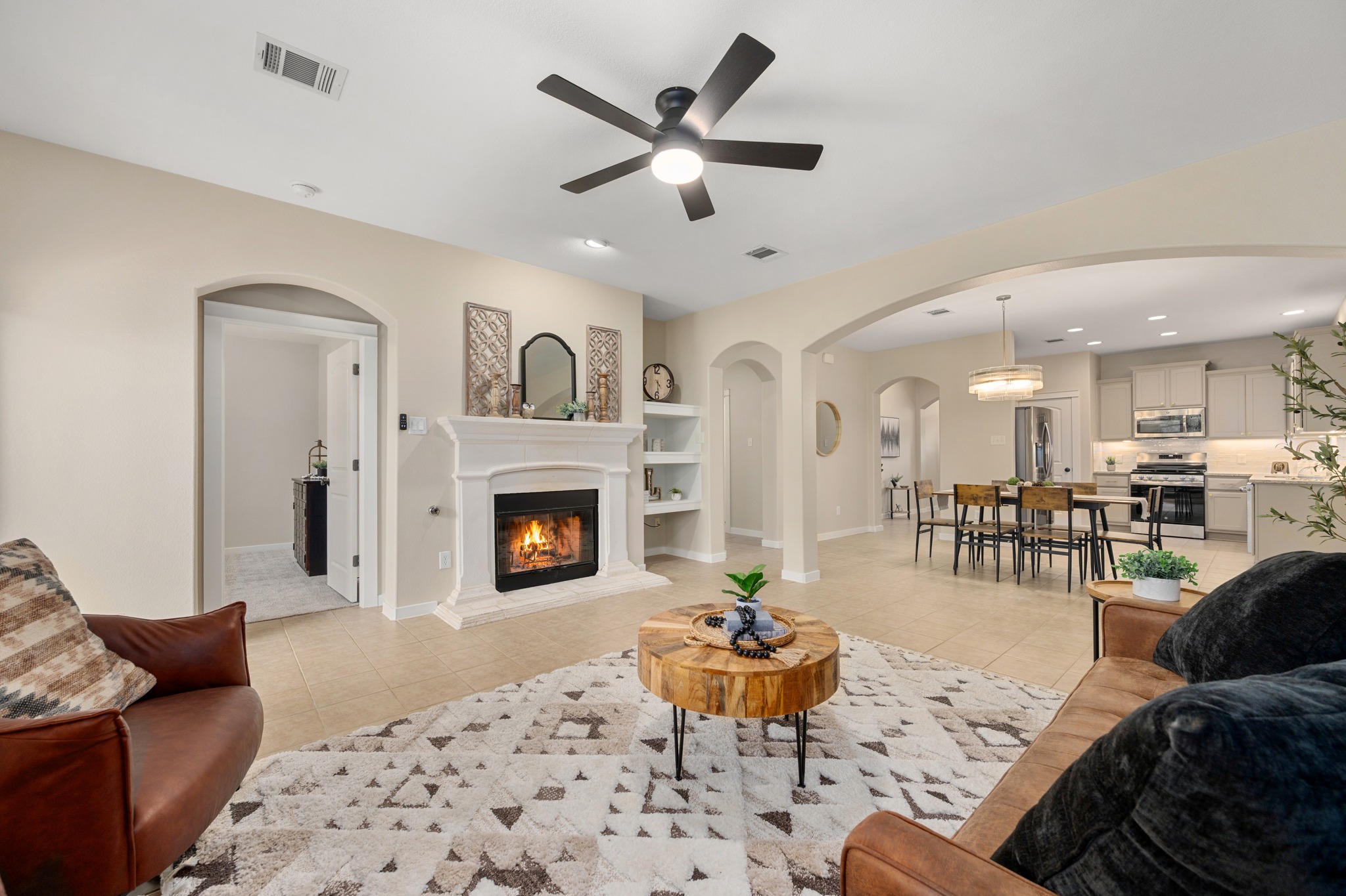 105 Rosebud Lane Georgetown, TX 78633 - Photo 9 of 37 a living room with furniture and a fireplace
