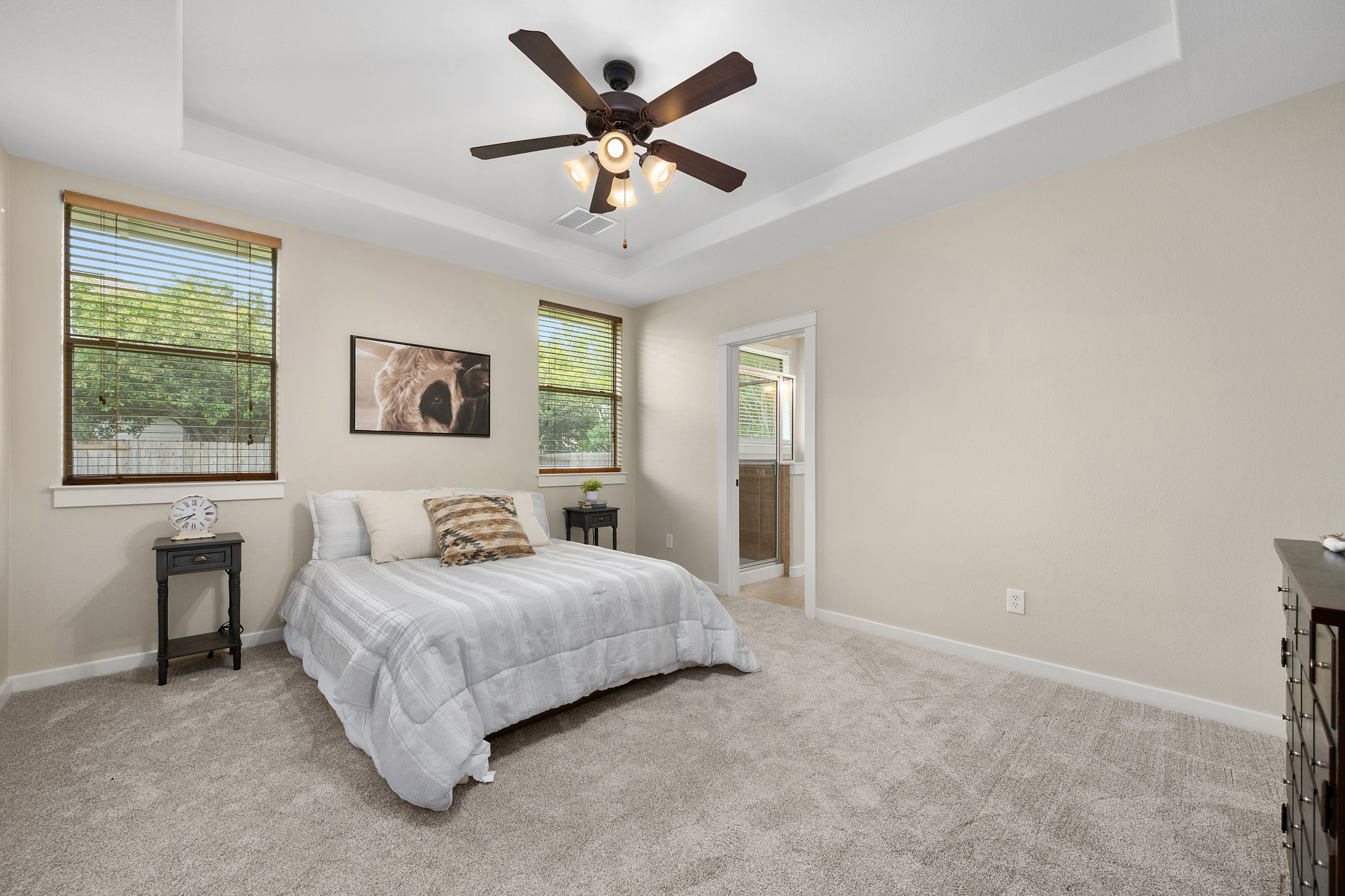 105 Rosebud Lane Georgetown, TX 78633 - Photo 11 of 37 a bedroom with a large bed and a window