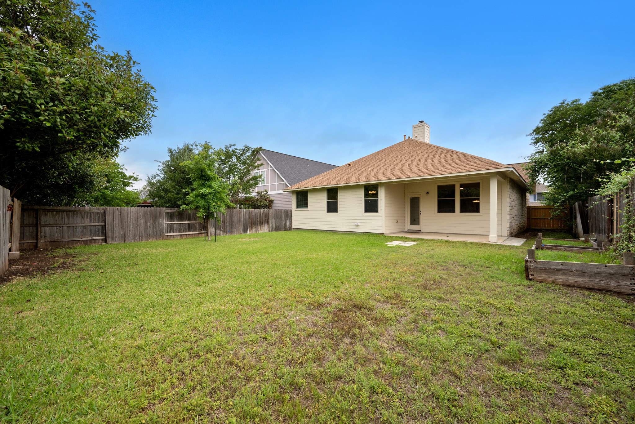 105 Rosebud Lane Georgetown, TX 78633 - Photo 22 of 37 a front view of a house with a garden