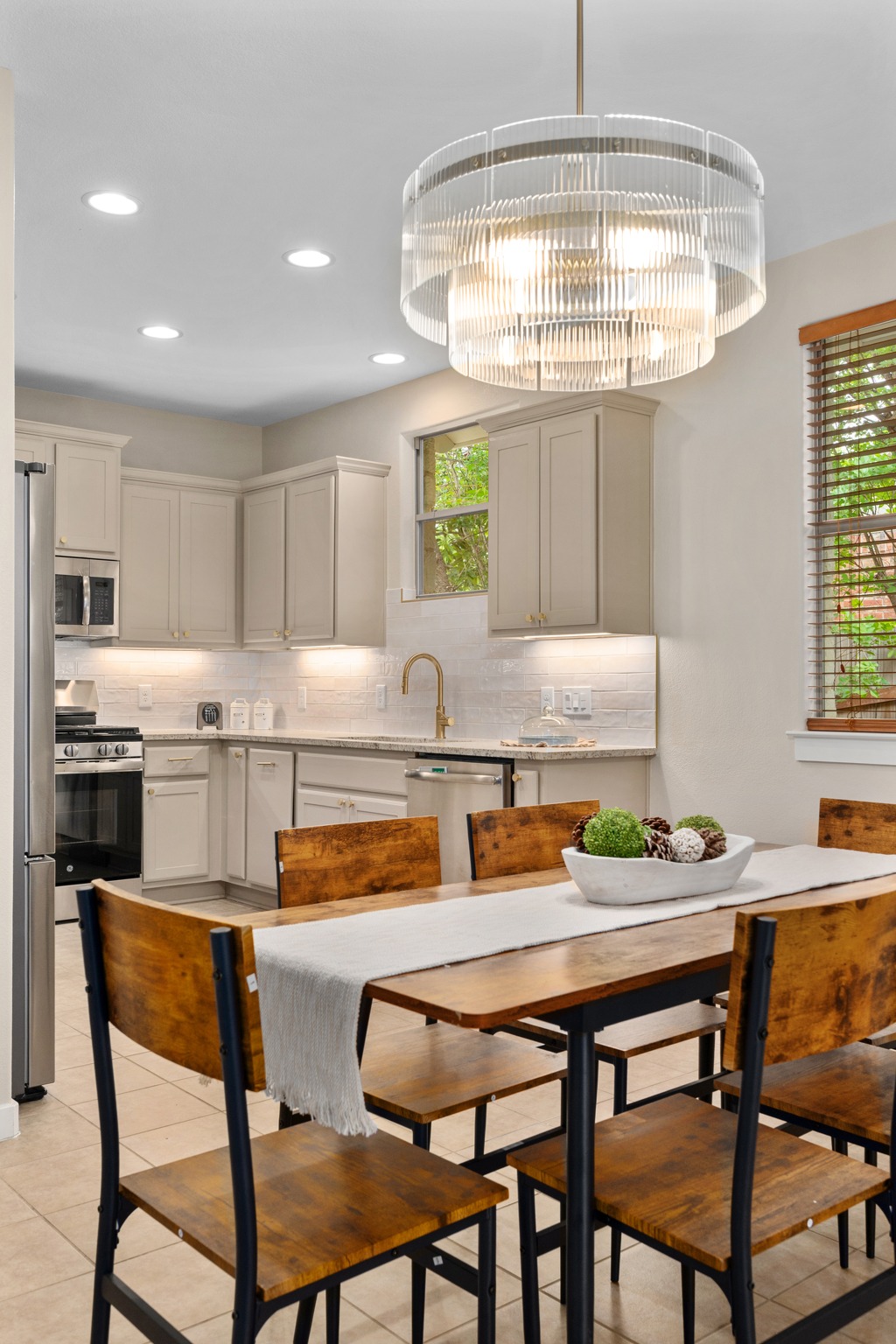 105 Rosebud Lane Georgetown, TX 78633 - Photo 5 of 37 a kitchen with a dining table chairs and chandelier