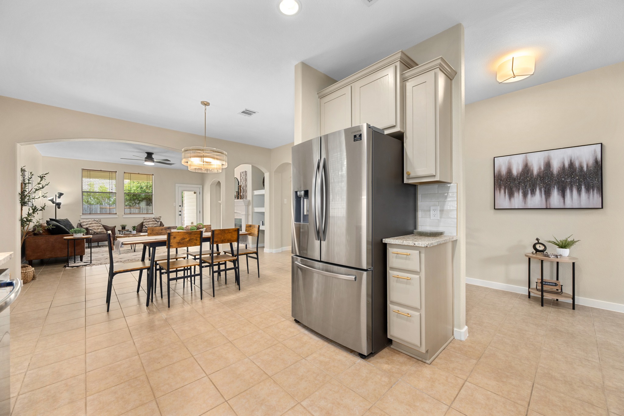 105 Rosebud Lane Georgetown, TX 78633 - Photo 35 of 37 a kitchen with refrigerator and chairs