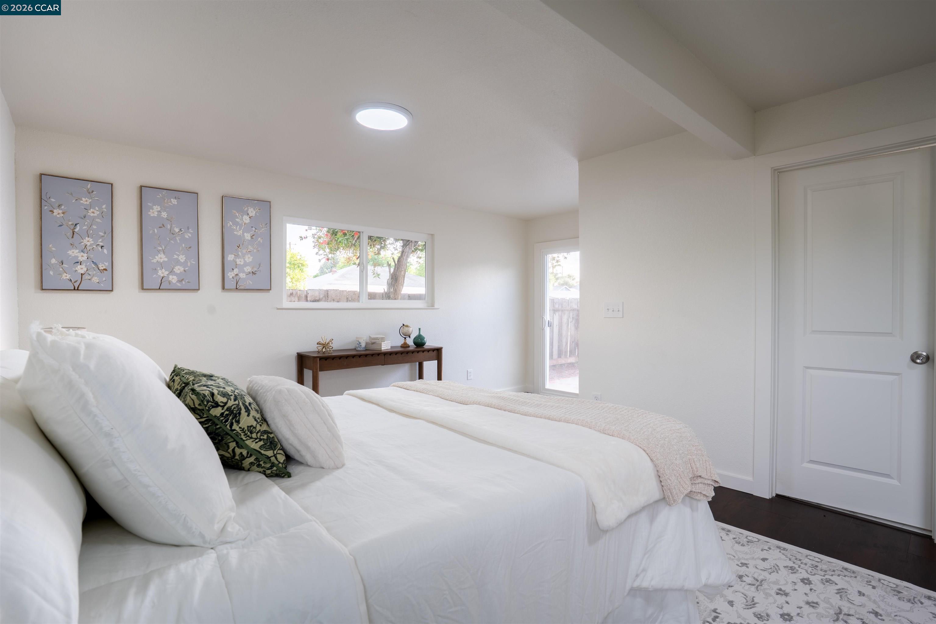 58 Solano Avenue Bay Point, CA 94565 - Photo 11 of 23 a bedroom with a bed and a window